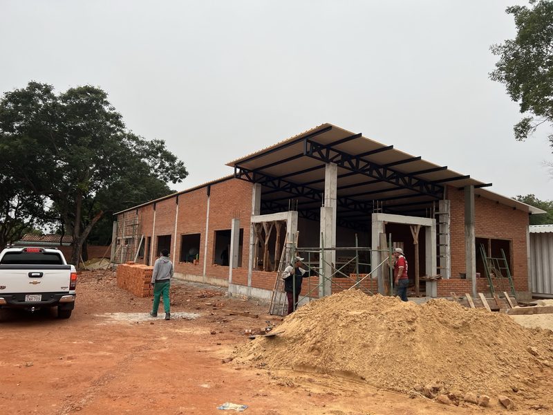 Office building under construction, with exposed brick walls
